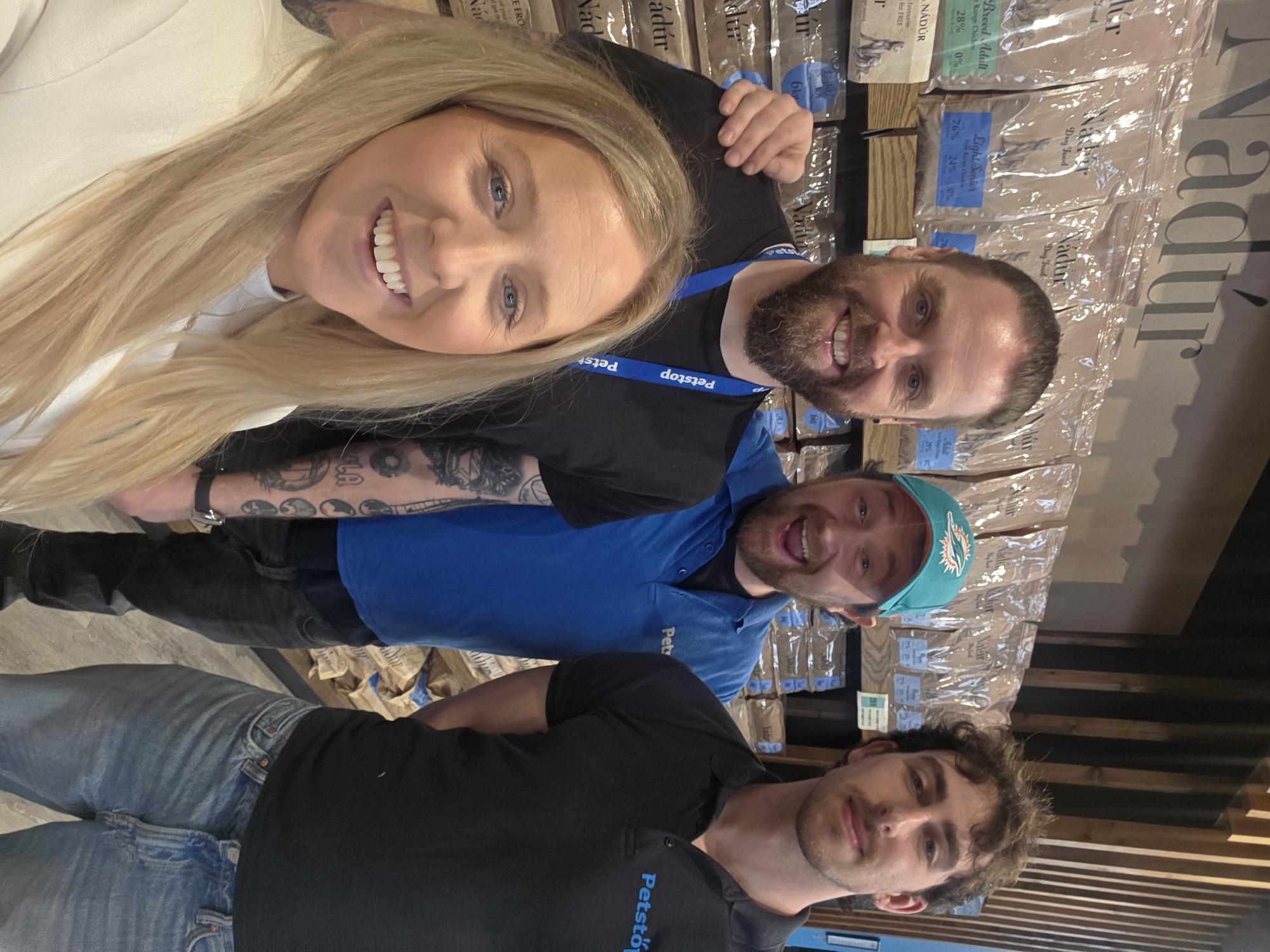 Louise Lally with three Petstop team members in front of a Nádúr dog-food display